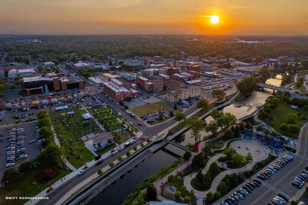 And drone shot over the city of Elkhart as the sun is going down.